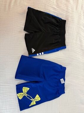 Two boys shorts. Athletic shorts. Size 4 and four. Adidas & under Armour brands.